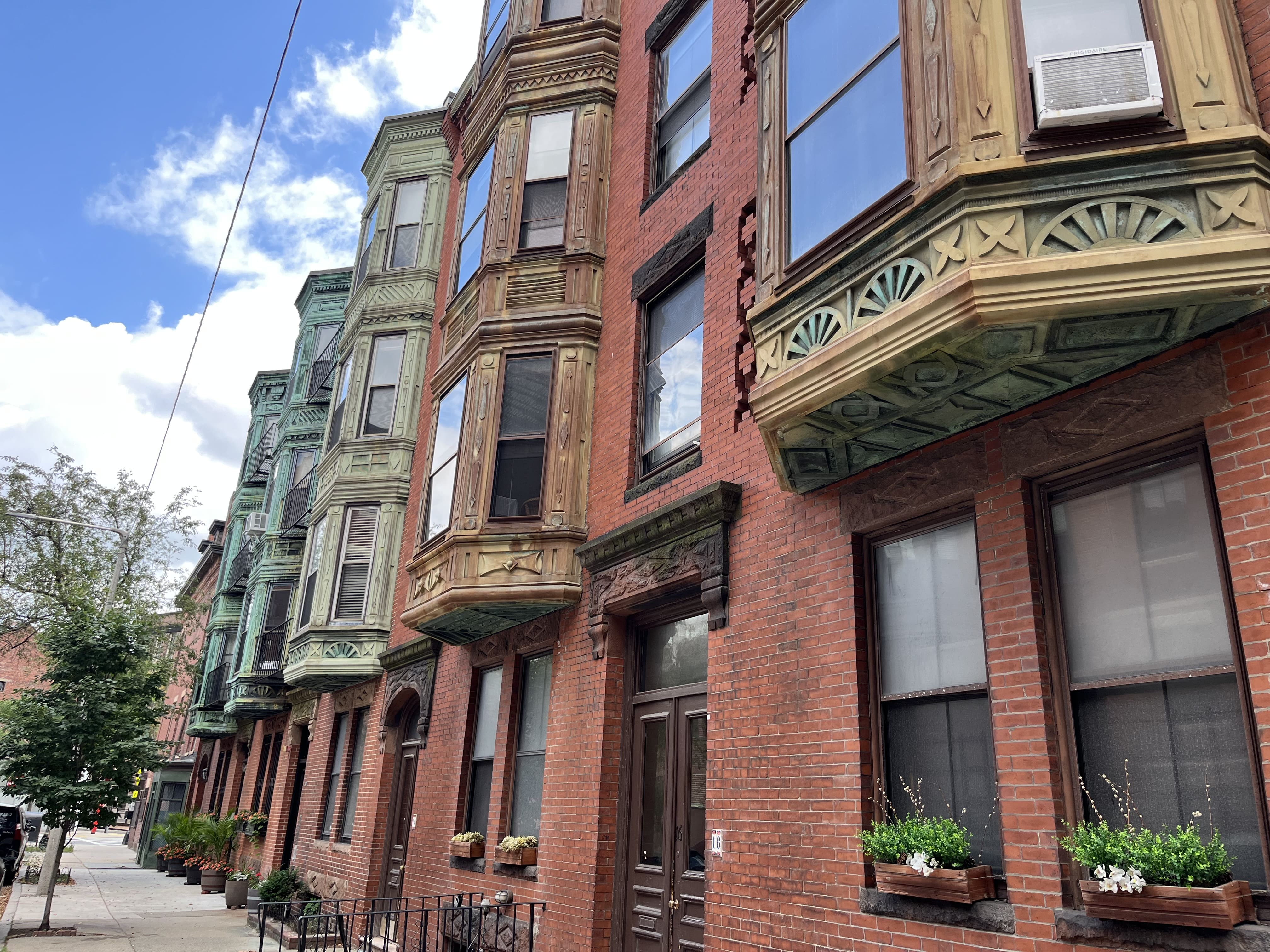 Brick row houses on a residential street in Boston, Massachusetts